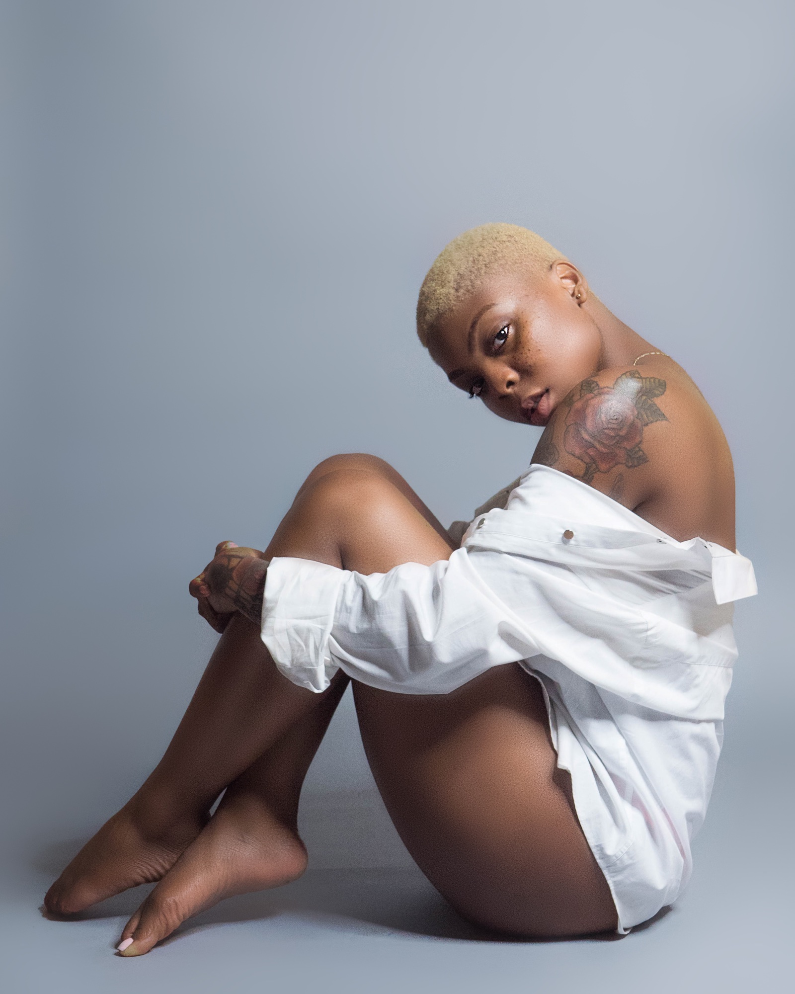 Studio editorial portrait in white styling